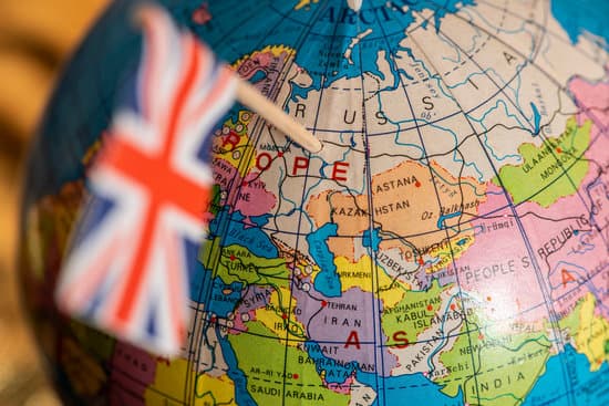 UK concept targeting Russia. British flag pricked on Russia on globe. The United Kingdom focused on Russia on the map.