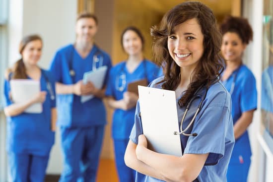 Medical students smiling at the camera at the university