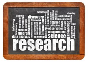 research word cloud on an isolated blackboard - science concept
