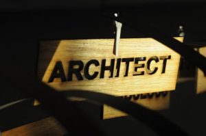ARCHITECT on a wooden sign