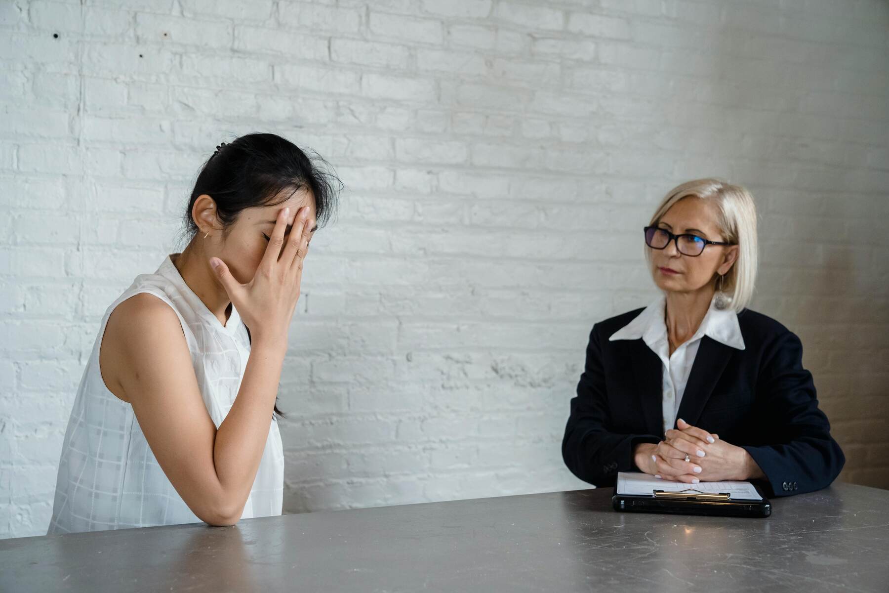 A behavior analyst talking to a frustrated client