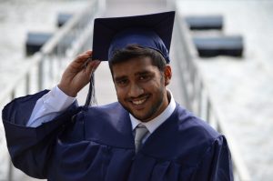 Man wearing a graduation robe and cap