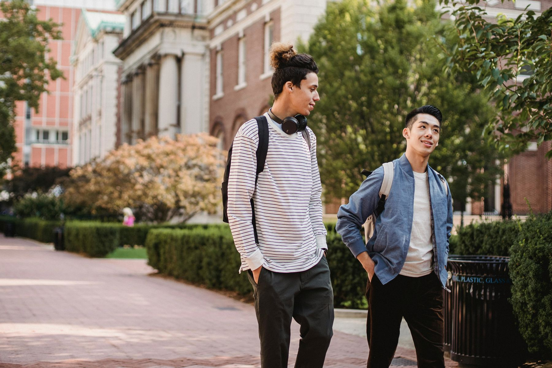 Two male students walking around the campus grounds together